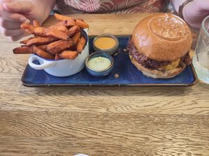 Smashed patty burger and sweet potatoes fries at SIGGIS v/gan dine & co. in Munich