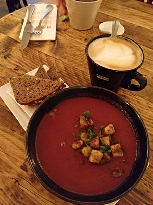 Beetroot soup and cappuccino at SIGGIS v/gan dine & co. in Munich