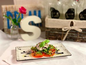 Selbst gemachter Cashew Mozzarella mit Tomaten, Rucola und Balsamico Glace - yummy :-D at SIGGIS v/gan dine & co. in Munich