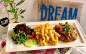 Soy schnitzel with mushrooms and fries and salad - yummy :-) at SIGGIS v/gan dine & co. in Munich