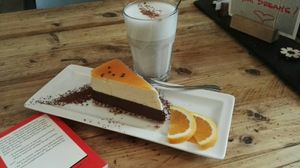 Chocolate passion fruite tarte from heaven and oat milk chai latte... :) at SIGGIS v/gan dine & co. in Munich
