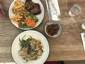 Schnitzel, mushroom risotto, and fried oyster mushrooms at SIGGIS v/gan dine & co. in Munich