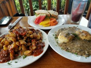 Crispy Potatoes w/ Jamaican Jerk BBQ Sauce and Biscuits w/Mushroom Gravy at Bread and Chocolate in Puerto Viejo De Talamanca
