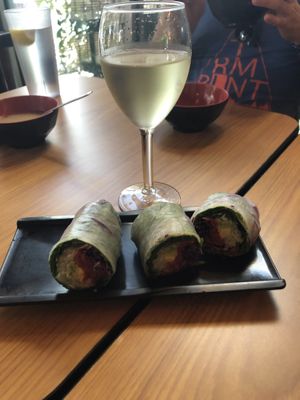 Summer rolls and white wine  at Koriente in Austin