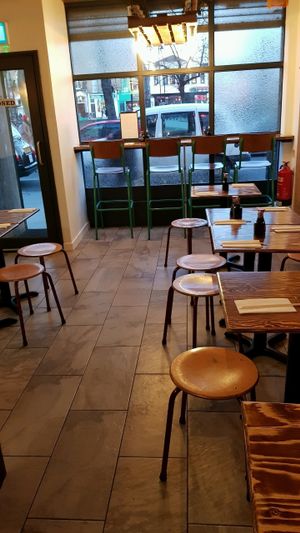 It has tables and chairs... at mamalan - Clapham in South West London