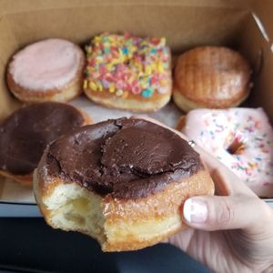 Boston cream up close but that fruity pebbles yum at Valkyrie Doughnuts in Orlando