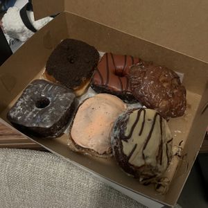oreo, red velvet, apple fritter, choco-lit, strawberry passion fruit lemon filled, coconut cookie butter   at Valkyrie Doughnuts in Orlando