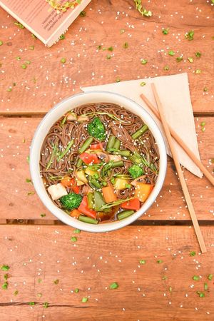 It has a light umami broth with buckwheat noodles, seasonal vegetables, shiitake mushrooms and homemade tofu topped with spring onions and toasted sesame seeds. at Bodhi Greens in Dharamshala