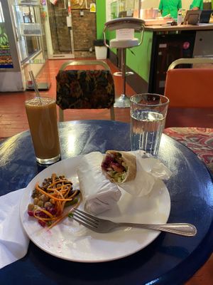 Falafel wrap and juice. Water included. at Manchester Vegan Cafe in Manchester