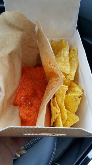 Tortilla xhips with home-made red pepper sauce at Manchester Vegan Cafe in Manchester