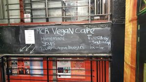 Sign on stairwell at Afflecks at Manchester Vegan Cafe in Manchester