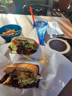 Vegan torta de carne asada with mole on the side at Hugo's Cocina  in San Diego