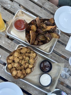 Garlic potatoes and popcorn chicken  at Grains  in San Diego