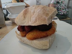 Vegan brunch ciabatta with hash browns, vegan sausages and vegan black pudding. at Chapter 17 in Hebden Bridge