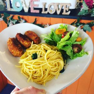 Tempeh, sweet potato, chestnut and cheekpea cakes, with glúten free pasta and organic green salad  at Fortuna Cafe in Sintra
