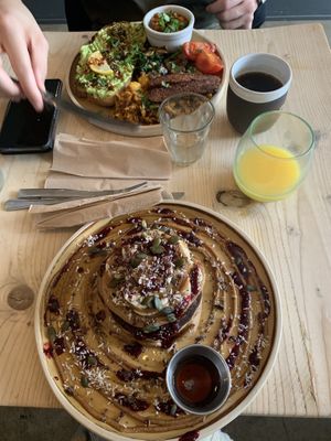 Avocado toast with facon and pancakes at The Longhouse Cafe in Brighton
