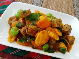 Amazing bitter beans (sator) fried with baby corn, mushrooms and tofu in red chile paste. at The Social Salad in Hua Hin
