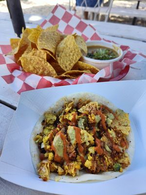 breakfast taco, nachos, and queso at The Vegan Nom - E Cesar Chavez  in Austin