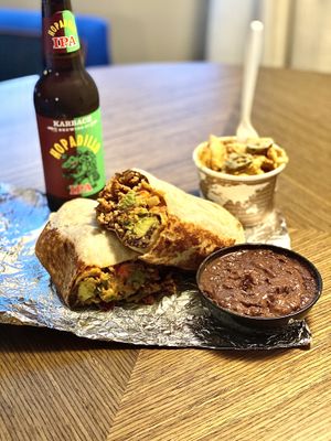 Jorges beef burrito, jalapeño mac and cheese and a side of beans (beer from somewhere else)   at The Vegan Nom - E Cesar Chavez  in Austin