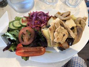Baked potato topped with mock chicken pieces, maple tofu & roasted veg at Coco's Canteen  in Weston-super-mare