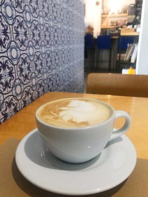 Latte in the dining room  at De/Raiz Cocina Café - Calle 65 in Bogota