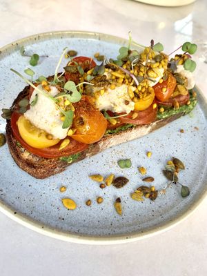 100% vegan - Bruschetta caprese (sourdough toast, pesto, roasted tomatoes, vegan mozzarella, salad, seeds).  at The Therapist - LxFactory in Lisbon