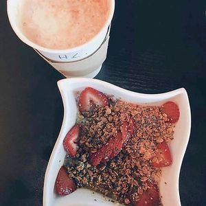 Strawberry Oatmeal make sure you request no honey if you don't eat honey and latte with califia farms almond milk. at Honey Cup Coffee and Kitchen in Oxnard