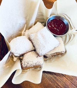 Vegan Beignets. Made-to-order French Quarter beignets. Deep-fried pillows of fluffy dough, house raspberry dip, dusted with powdered sugar  at The Wild Chive in Long Beach