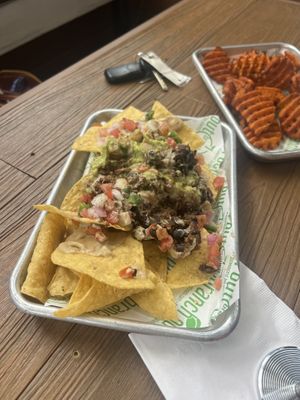 Crispy black bean and quinoa nachos and sweet potato fries.   at Branch Out in Paducah