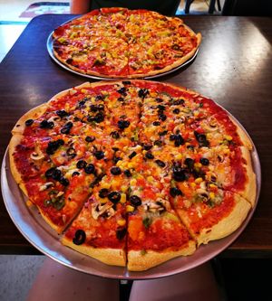 Extra large pizzas with vegan cheese at Sugar Pine Pizza in Oakhurst
