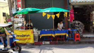 Move across the street at Pan Road - Vegan Food Cart in Bangkok