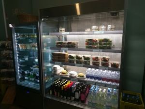 fridge with vegetarian and vegan food items at La Granadilla in Forli