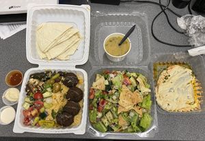 Hummus, falafel platter with a side of lentil soup, and fattoush.  at McBani Authentic Lebanese Cuisine in Seaside