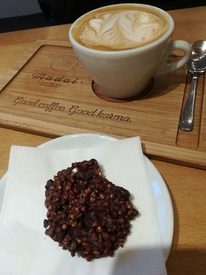Oatmylk cappuccino and raw vegan chocolate 🍪 at Madal Coffee Co - Ferenciek Tere in Budapest