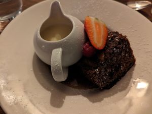 Sticky gingerbread and pear cake with vegan custard at The Walnut Tree in Eye