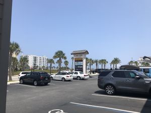 Nice day for an outdoor table with a view of the palms at the beach  at Delicomb in Jacksonville Beach