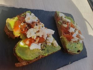 Tostada de aguacate, tomate y queso feta vegano at Roots in Tenerife