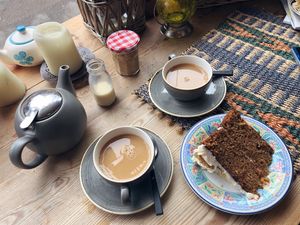 Tea and carrot cake  at Nomad Bakery in Reading