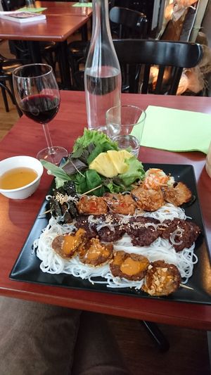 4 skewers with different flavours and fresh salad and fresh tasty herbs at La Palanche d'Aulac in Paris