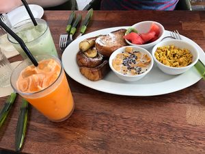 Green tea Latte, Carrot apple juice- Tofu scramble with chick peas and fruit, Banana and toast. All vegan at Around Green - 어라운드 그린 in Seoul