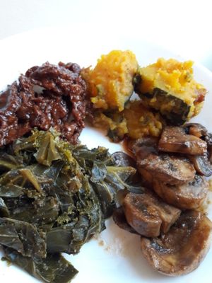 Spicy mushrooms, seasoned collards, pumpkin, and soy BBQ meat at Vegan's Choice in Brooklyn