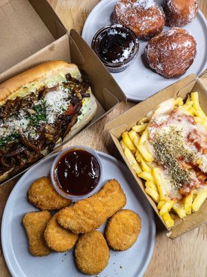 Chicken nuggets, pizza fries, funghi and parmesan sandwich and doughnuts at Jake's Vegan Steaks in North London
