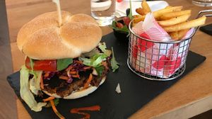 My bean burger which apparently was supposed to look burnt like this. I would not order this meal again, instead a Jackfruit burger or another selection from the menu.  at The Sound Lounge in South West London