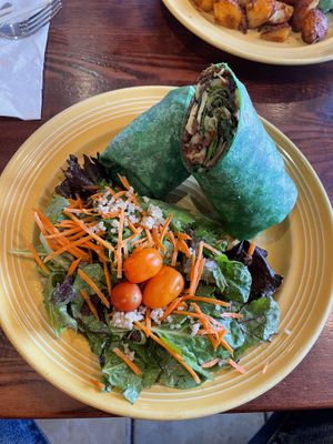 Had the Grill Veggie Wrap and because I don’t eat soy I replaced the tofu with the meat they use on their burgers. It black beans, grains and veggies.  I also added avocado.  at The Grain Cafe in Long Beach