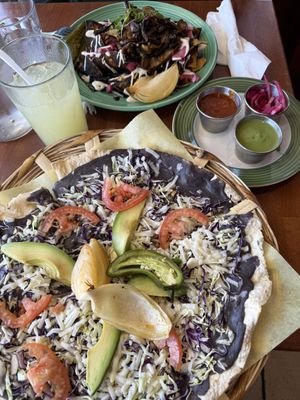 chilaquiles de mole and a tlayuda  at The Grain Cafe in Long Beach