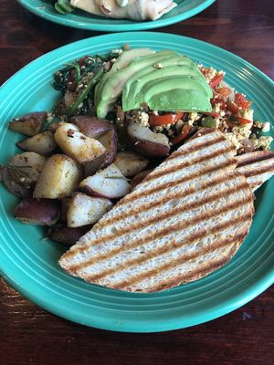 Tofu scramble with roasted potatoes and avocado at The Grain Cafe in Long Beach