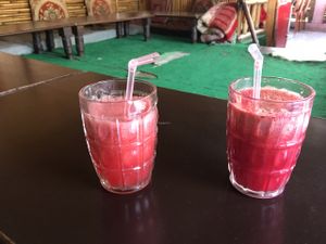 fresh watermelon juice (L) and carrot ginger beet juice with locally-grown red carrots  at Tip Top Restaurant in Rishikesh