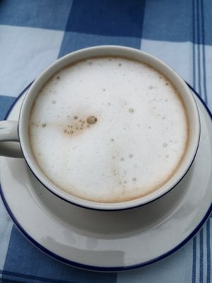Frothy cofffee with oat milk at Bleujennow in Penzance