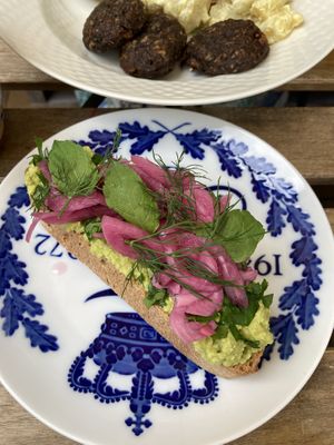 Pea mash open face with pickled onions, mint and dill  at Cafe Kosmos in Odense