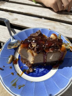 Vegan dessert pie with chocolate, peanut butter, and caramel drizzle    at Cafe Kosmos in Odense